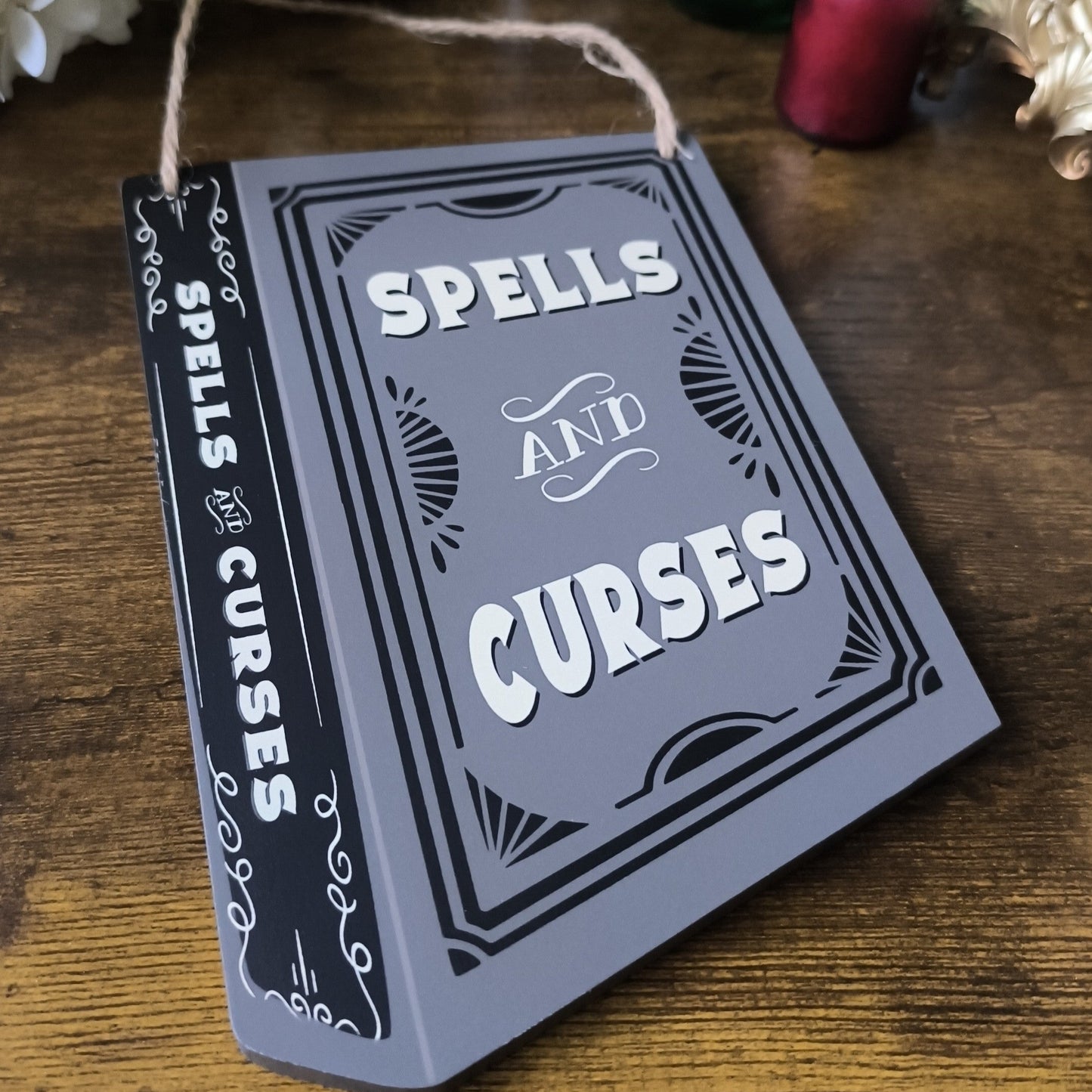 Spells and Curses Book Shaped Hanging Sign