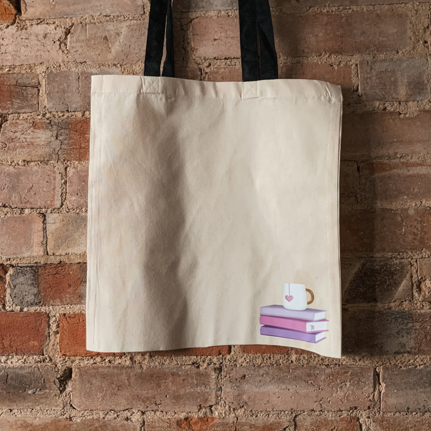 Corner Pastel Book and Mug Stack Natural Fabric Tote Bag with Black Handles