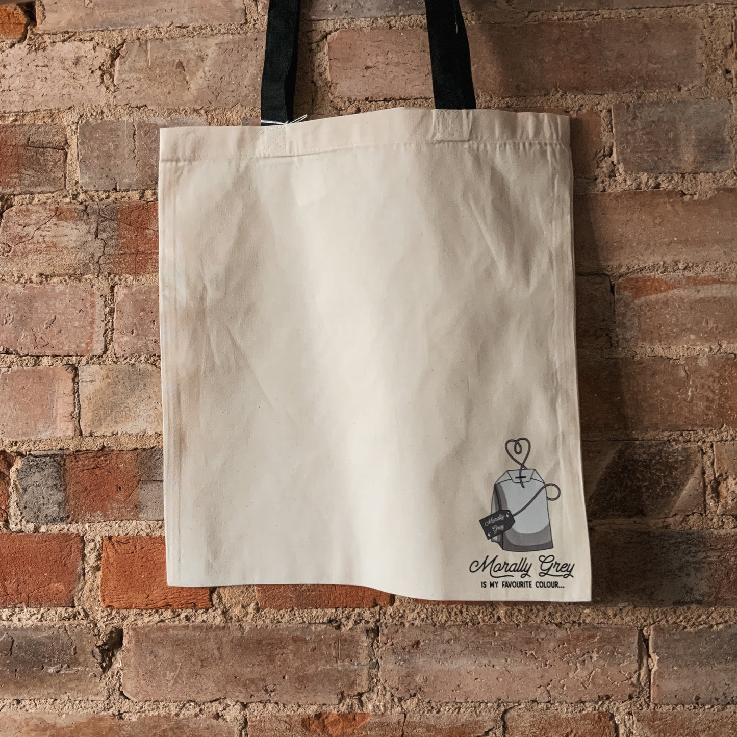 "Morally Grey is My Favourite Colour" Corner Tea Bag Natural Fabric Tote Bag with Black Handles