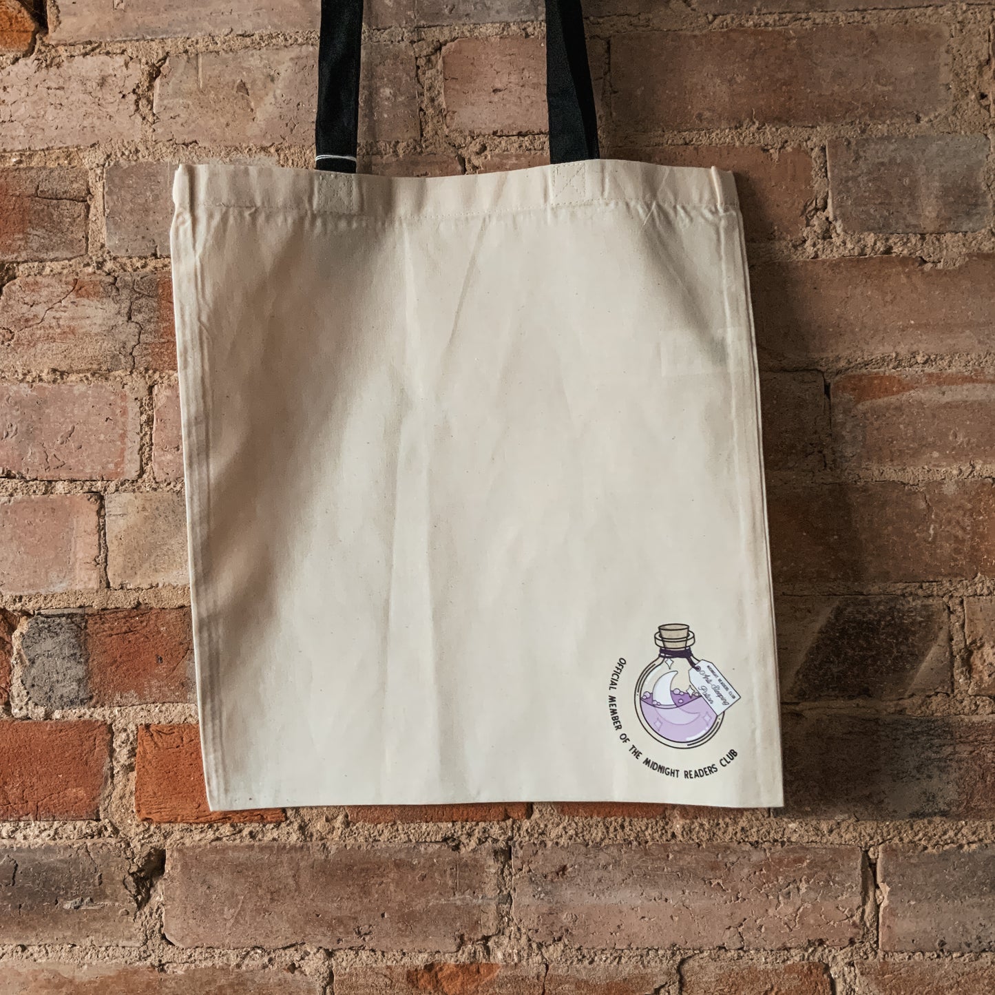 "Official Member of the Midnight Readers Club" Corner Anti-Sleeping Potion Bottle Natural Fabric Tote Bag with Black Handles